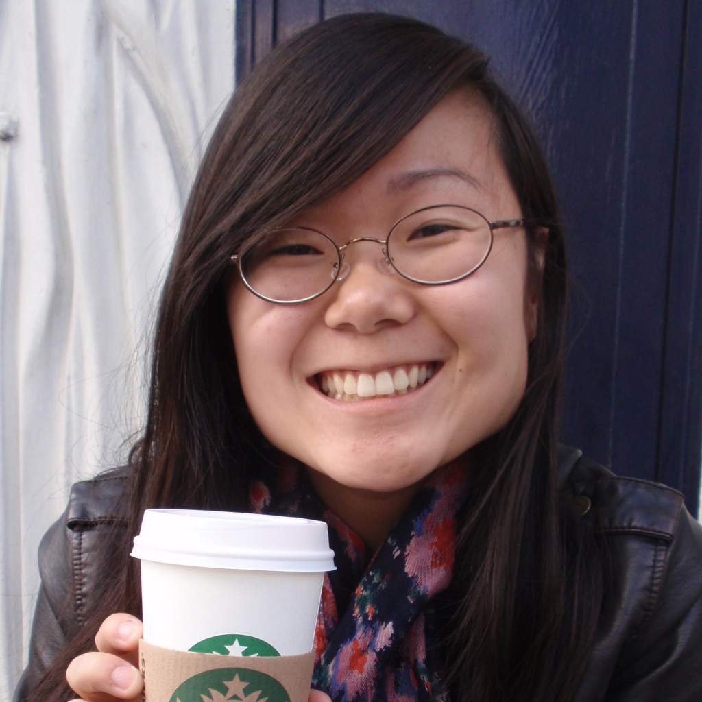 Photo of Lauren holding coffee cup