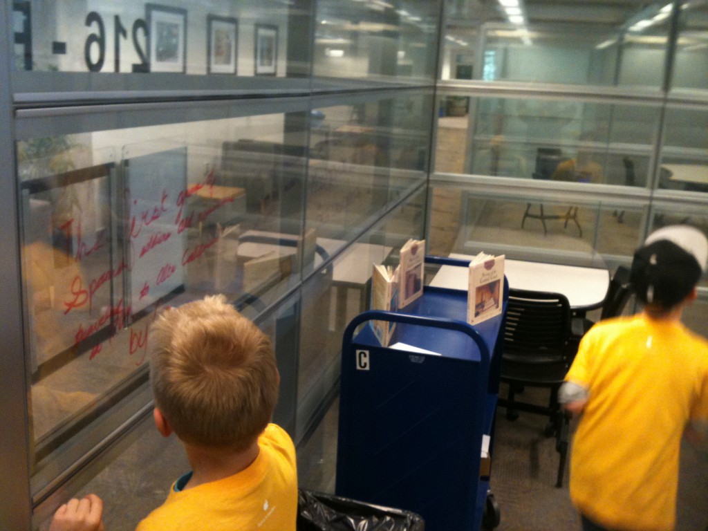 photo of fourth graders writing on the fish bowl walls