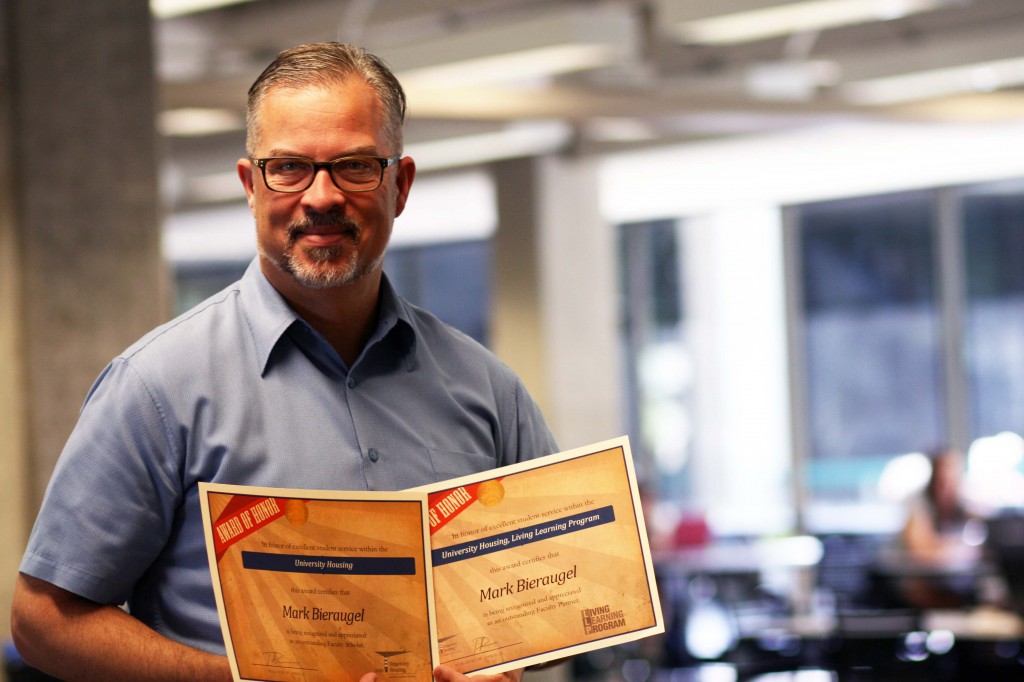 Photo of Mark with awards