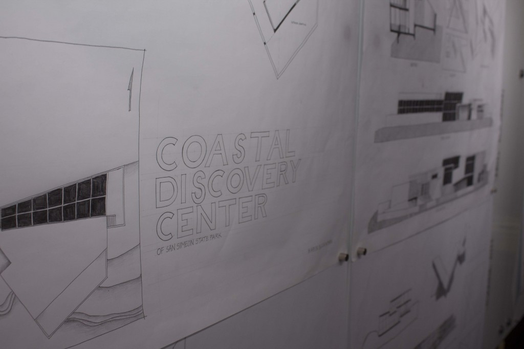 A white piece of paper reads "Coastal Discovery Center."