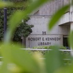 Photo of Kennedy Library through a tree